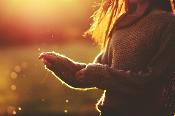 Reflections of light on a girl in a sweater