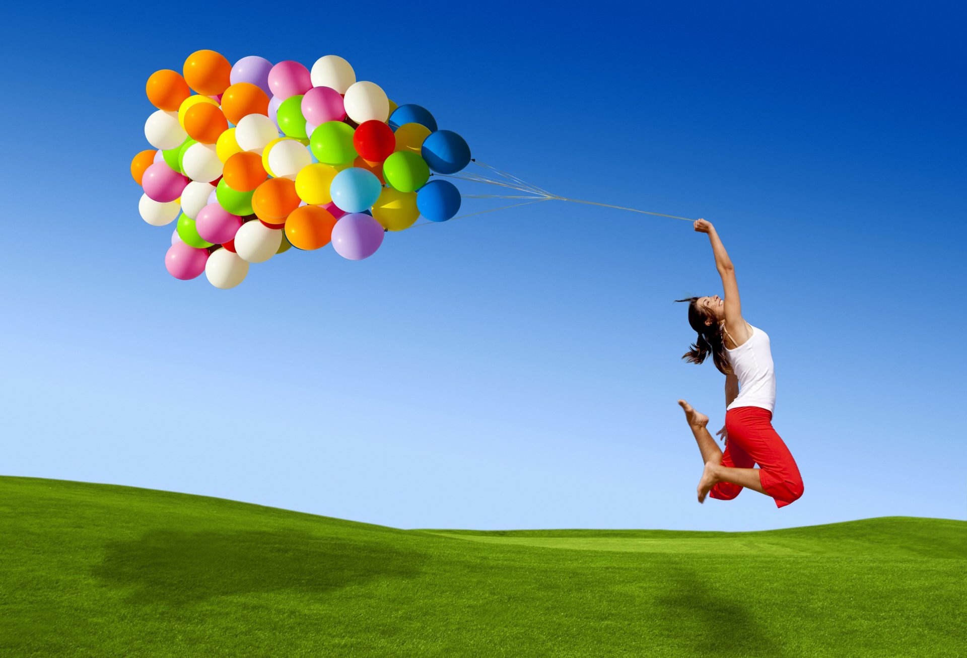 girl jump flight balls bulbs many flowers colored happiness smile grass sky