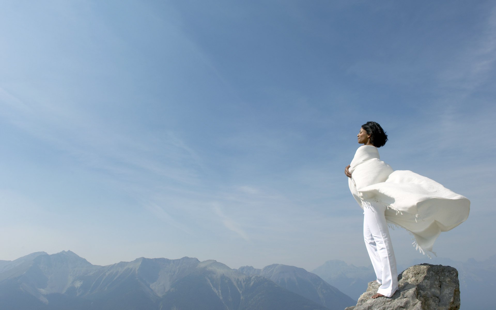 girl rock mountain summit sky white wind