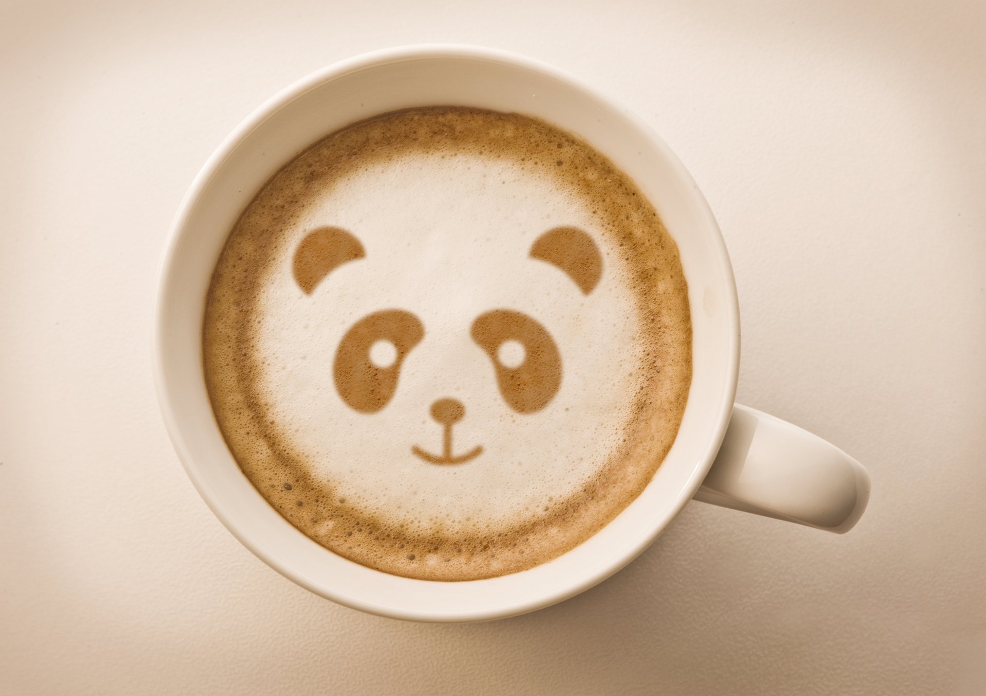 sfondo tazza caffè schiuma disegno panda