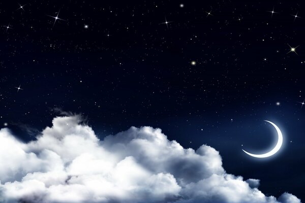 A clear moon behind the clouds among the stars