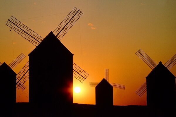 Four mills at sunset