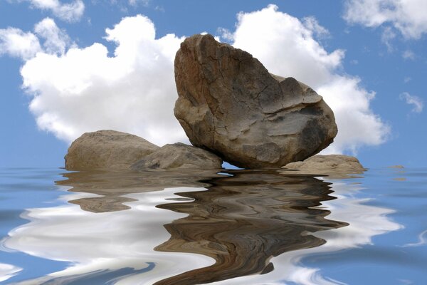 Piedras en el reflejo de la superficie del agua