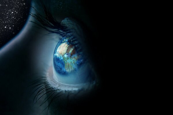 Reflection of the planet Earth in the eye