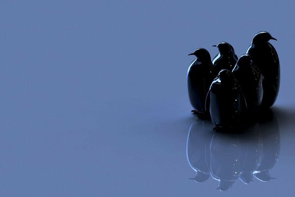 Figures de pingouins sombres avec réflexion