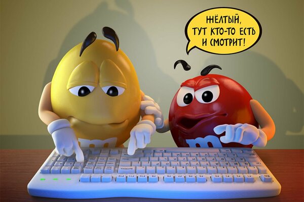 Two cartoon candies behind the keyboard