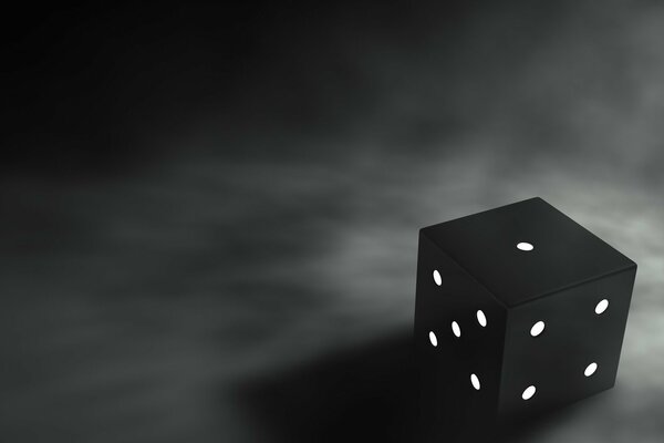 Noir cube avec белимы points sur un fond sombre