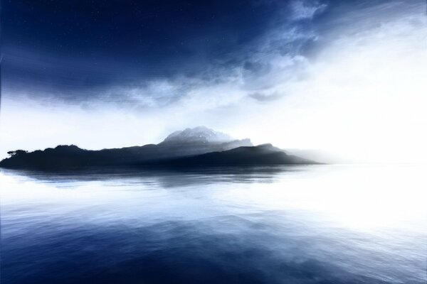 An island in blue water in a fog