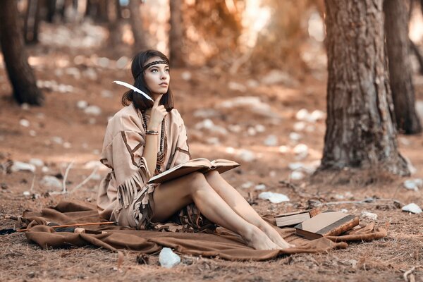 Fille avec une plume lisant un livre