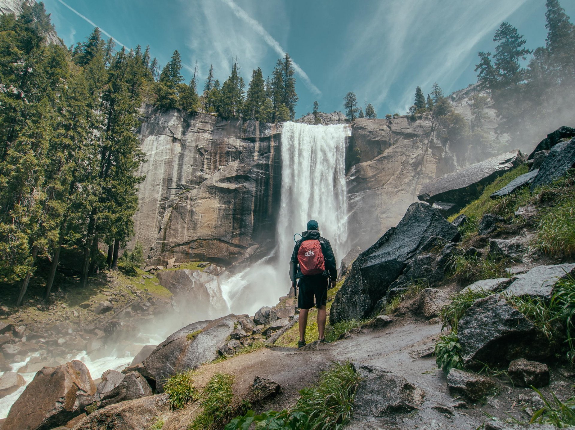 rock forest waterfall nature tourist traveller admires the scenery