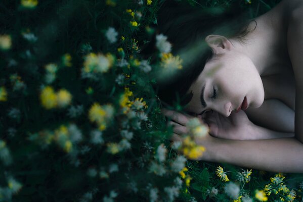 Sleeping girl on the grass resting