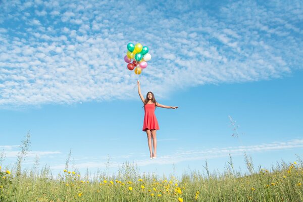 Flying girl with colored balls