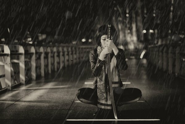 Girl with a katana in the rain