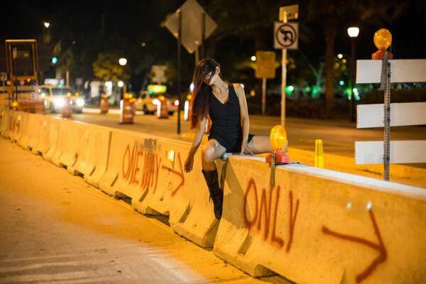 Beautiful girl on the road at night