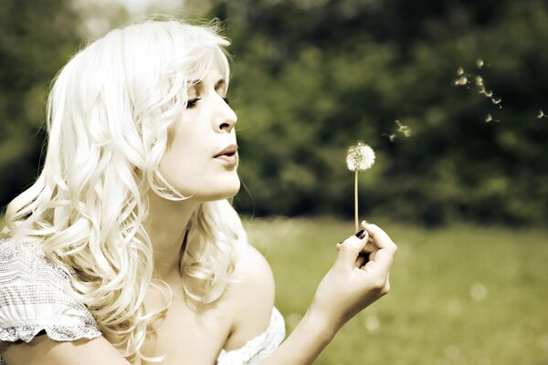 Nature. Summer. The girl with the dandelion