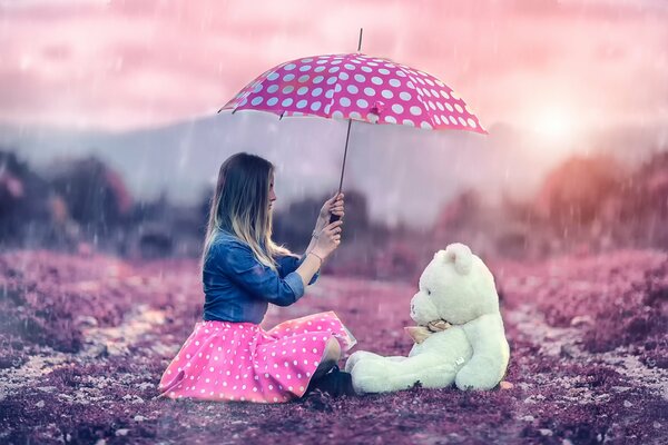 La fille avec le parapluie et avec un ours en peluche, Teddy