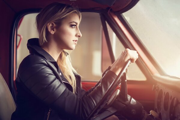 The girl with blonde hair in the car