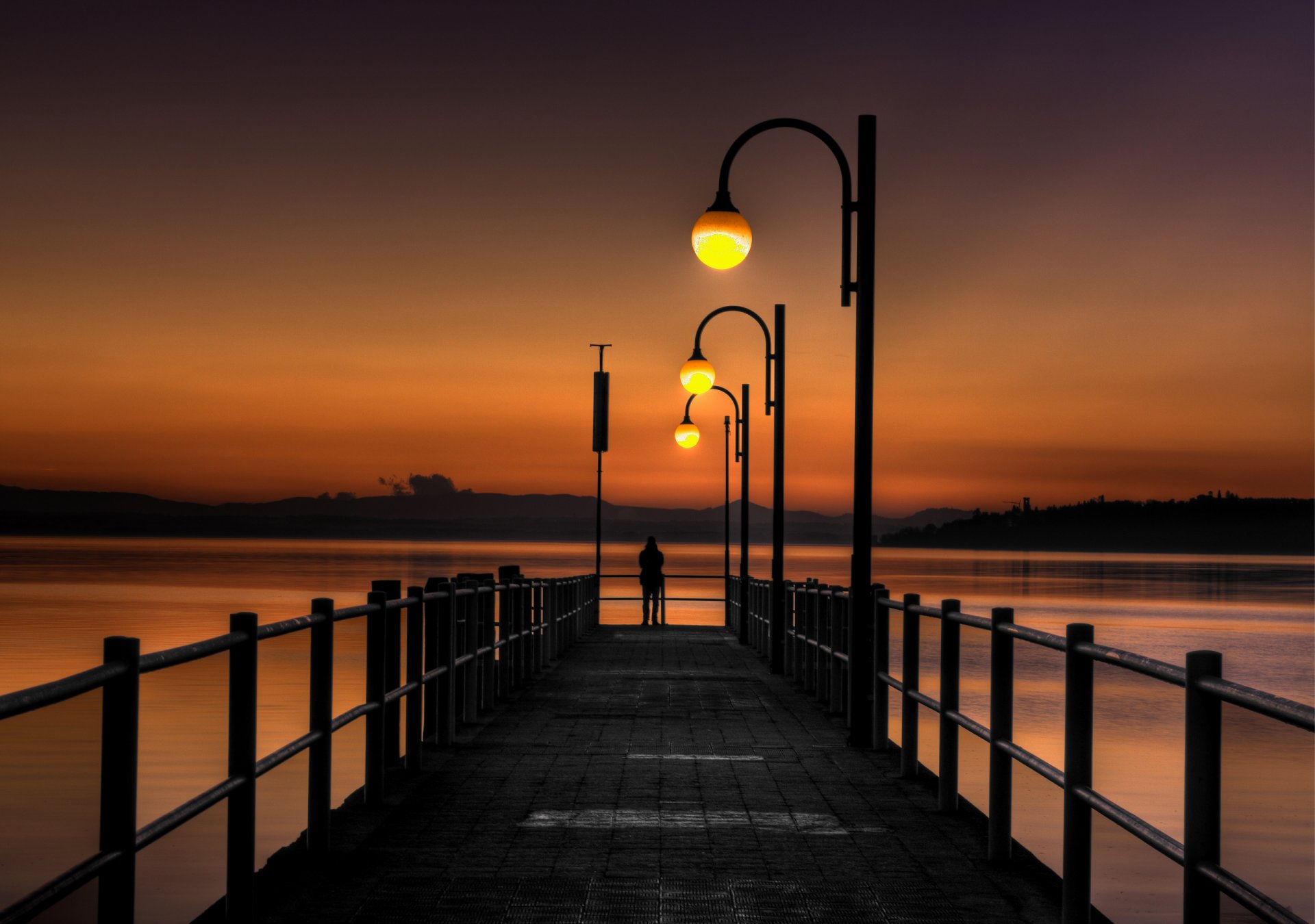 unset bridge pier sea light