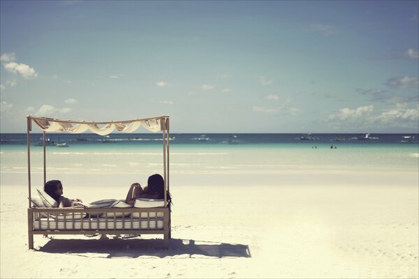 Girls relax on the beach of the Philippines