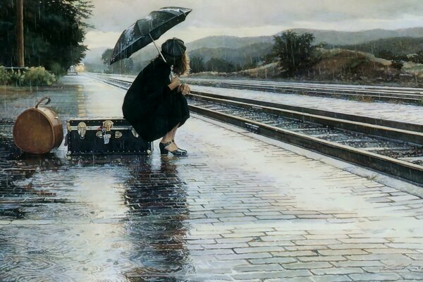 Platform in the rain. The girl on the suitcase