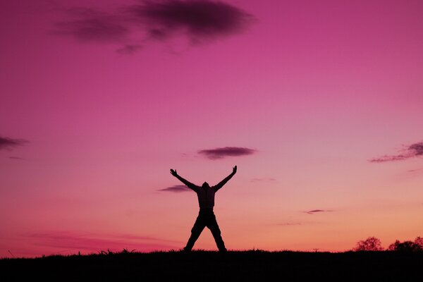 The joy of freedom against the background of dawn