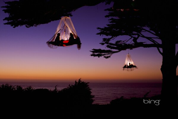 Romantic date at sunset in hammocks