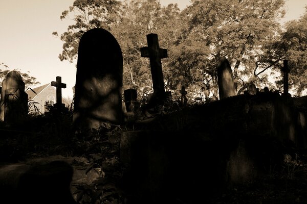 A gloomy cemetery at night with crosses