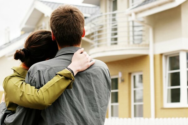 Couple admires the house of cuddling