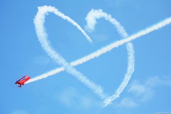 Heart sign in the blue sky