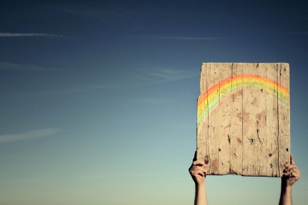 Positive. Rainbow in the sky. Happiness with your own hands