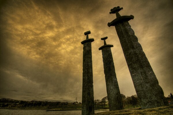 Greater than swords against the background of the river and the sky