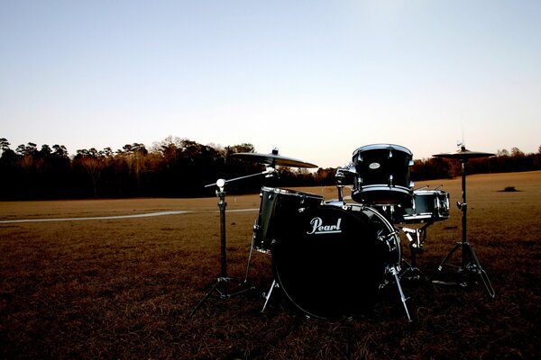 Drum set in the field. Music