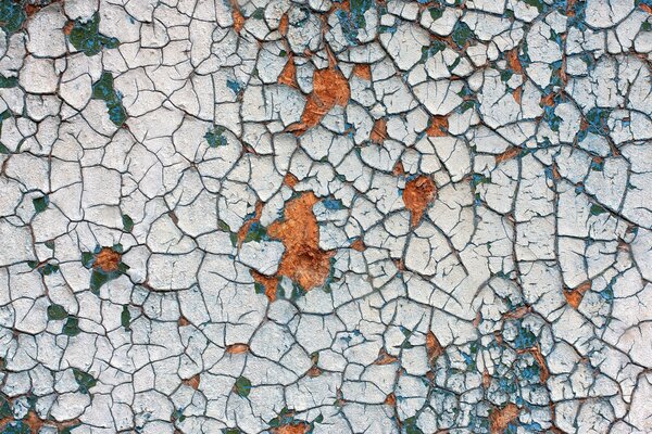 The texture of cracked paint on the wall