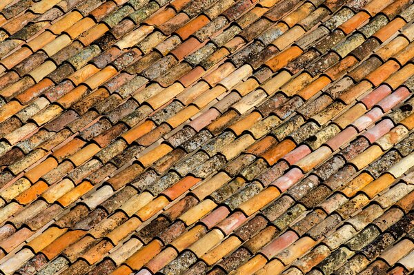 Old tiles on the roof of the building