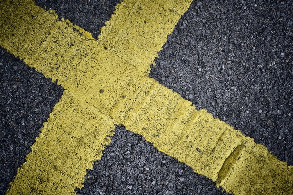 Intersection of yellow markings on asphalt