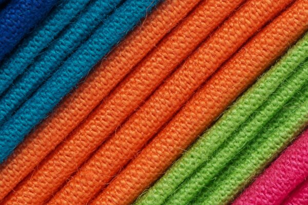 The texture of the fabric is blue, orange and green