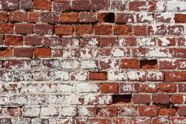 Image of a destroyed brick wall