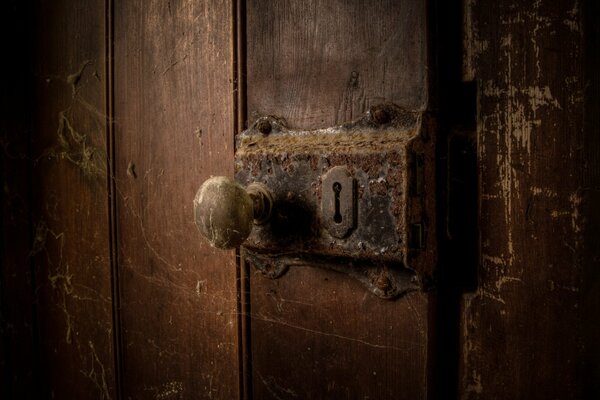 An old lock on a slightly open door