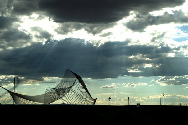 The grid develops in the wind against the background of heavy clouds