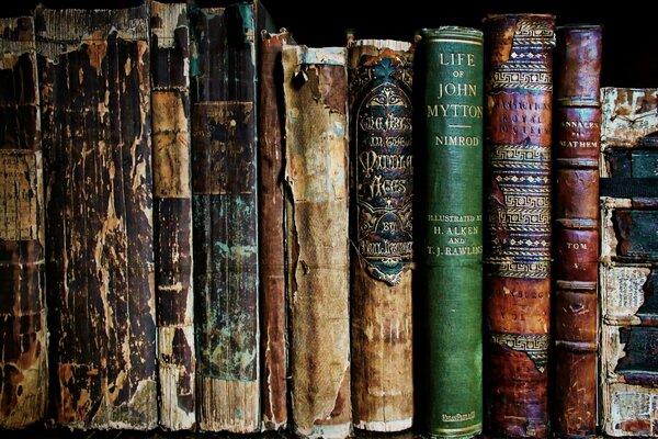 Battered old books on the shelf