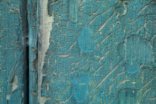 Die Textur der Farbe auf den Brettern ist blau