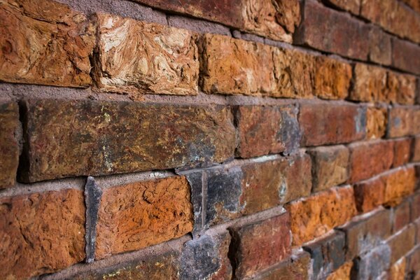 Red brick wall with concrete