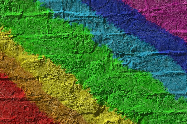 Peinture multicolore sur un mur de briques