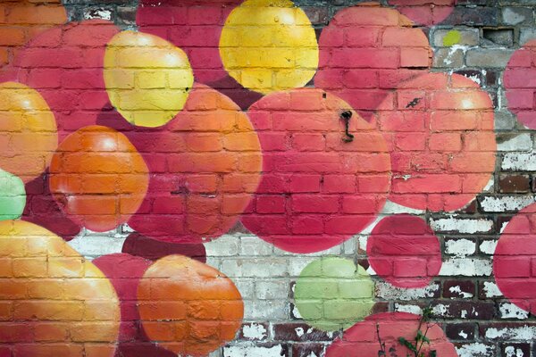 A wall painted with multicolored balls