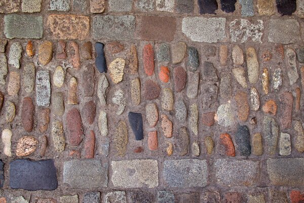 Cobblestones made of cobblestones, which are laid out on the street