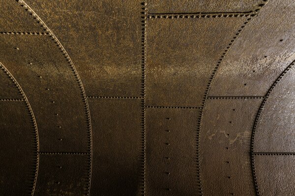 Rusty metal surface with rivets