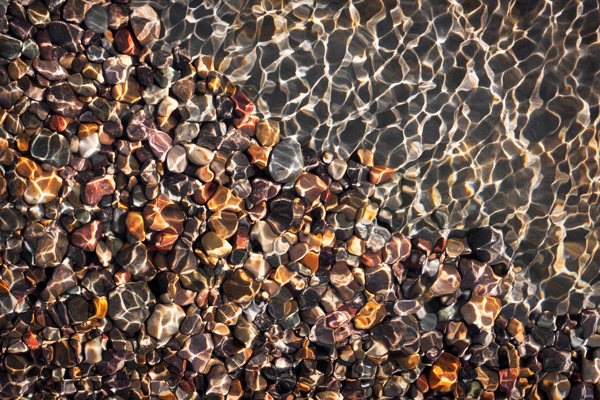 beach pebbles water reflection