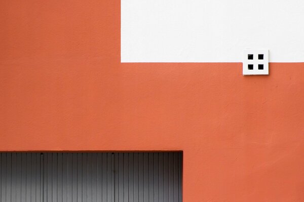 Geometric wall in white, black and orange colors