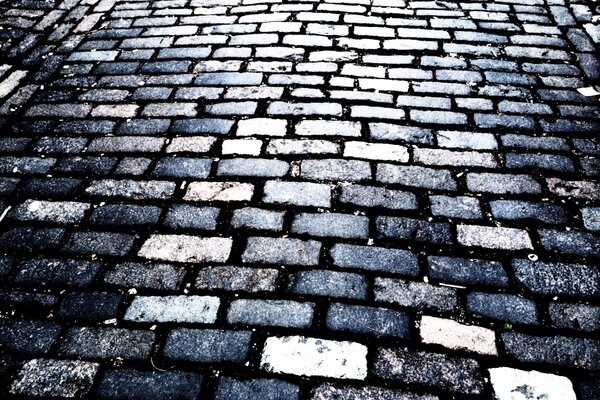 The road is covered with stone paving stones