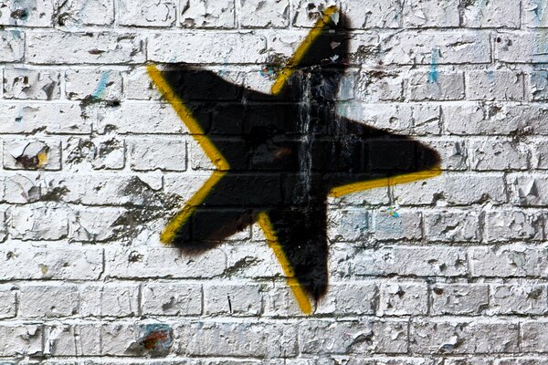 A black star on a white wall